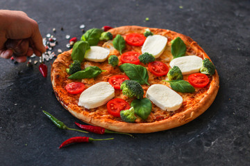 pizza, broccoli, tomato sauce, cheese and more. food background