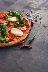 pizza, broccoli, tomato sauce, cheese and more. food background