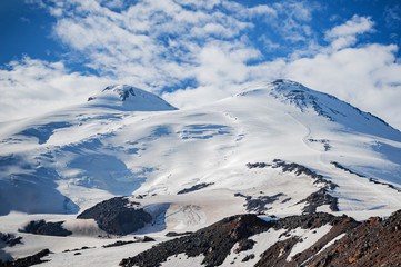 Fototapeta na wymiar The western and eastern peaks of Elbrus closeup