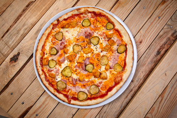 pizza on the wooden background