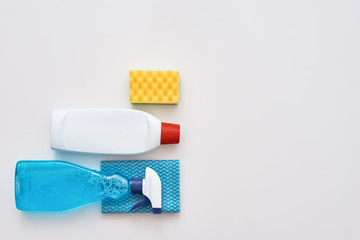 Cleaning tools. Spray bottle, orange cleaner sponge and cleanser isolated