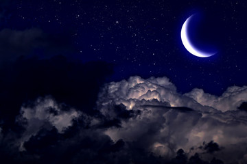 Obraz na płótnie Canvas Evening crescent in the cloudy sky