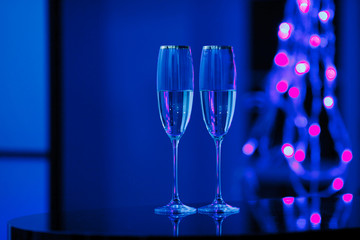 A pair of glasses of champagne in the interior. Holiday's concept.