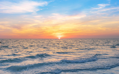 Fototapeta na wymiar calmness seascape in colorful sunset sky