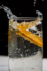 orange juice splash in glass