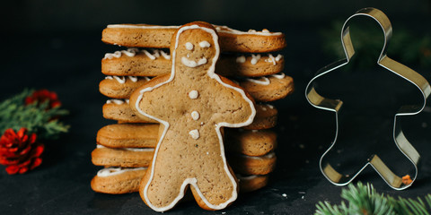 gingerbread man - handmade baking (dessert cookies). happy new year. food background