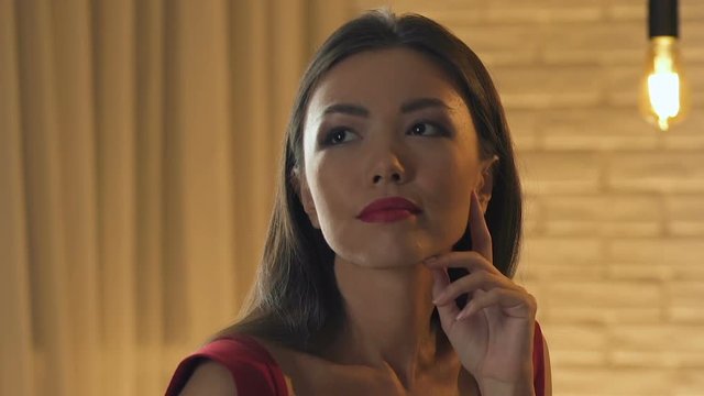 Beautiful lady displeased with boring conversation of man nearby, closeup