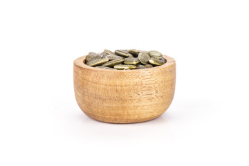 Hulled pumpkin seeds isolated on white