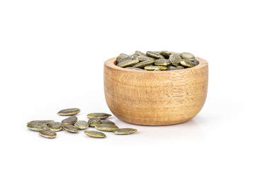 Hulled pumpkin seeds isolated on white