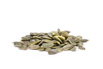 Hulled pumpkin seeds isolated on white