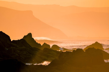 Spectacular sunset on the coast with orange tones