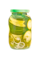 Homemade pickled zucchini two kinds in glass jar.