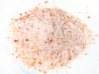 handful of ground pink himalayan salt on plate
