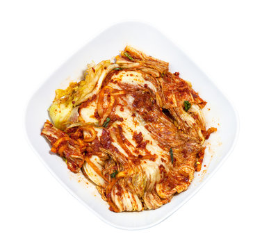 above view of kimchi in white bowl isolated