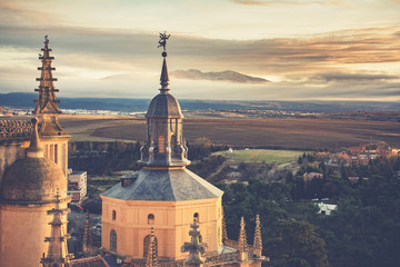 View of one of the towers of Segovia Cathedral in the background the Sierra de Guadarrama where you...