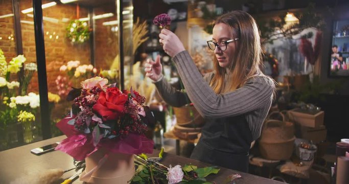 Business lady working on floral composition in