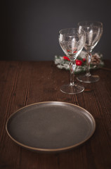 Serving on a wooden table with a Christmas decor in dark colors