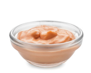 Tasty sauce in bowl on white background