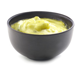 Tasty sauce in bowl on white background