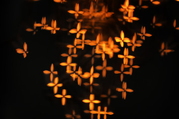 Blurred view of beautiful lights on dark background
