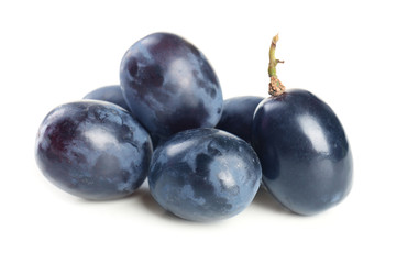 Ripe sweet grapes on white background