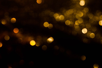 Obraz premium Magic lights christmas bokeh on black background. Can be used for your photos.