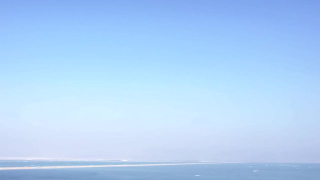 Blue sky over Dead sea surface. Neve Zoar. Israel