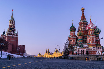 A view of Kremlin, St. Basil Cathedral,  Vasilevsky Descent and Red Square with Christmas and New Year decoration at sunset. Moscow, Russia
