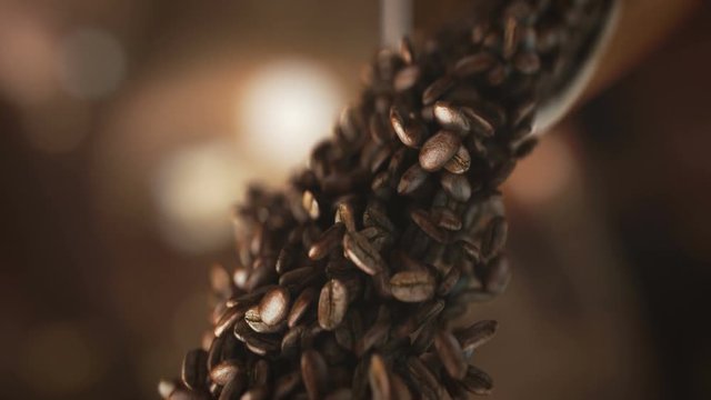 Falling coffee beans in super slow motion in 4K