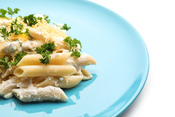 Plate with tasty penne pasta on white background