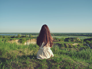 Relaxed young woman looking out into the view.