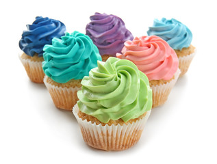 Colorful cupcakes on white background