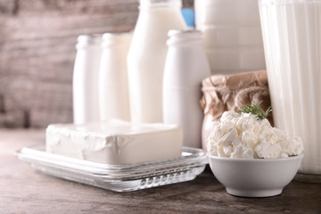 Different milk products on wooden table