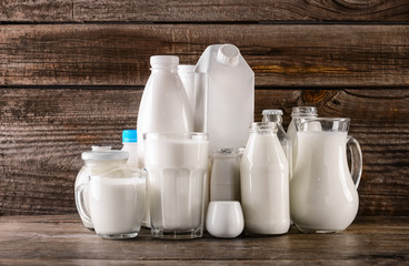 Different milk products on wooden table