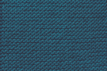 Blue woolen knitting fabric texture background