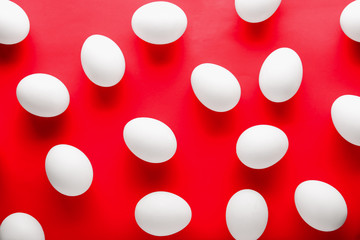 Raw chicken eggs on color background