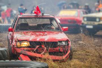 Obraz na płótnie Canvas a race of cars that hit each other. old broken cars in crashes during a race. auto catch and car crash rally