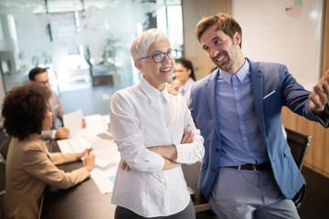 Group of successful business people at work in office