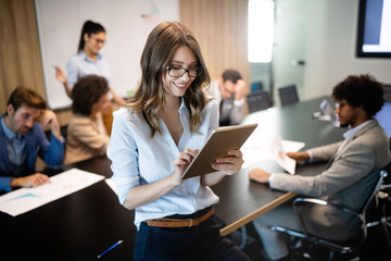 Group of successful business people at work in office