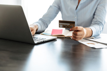 Close up of a businesswoman working on laptop