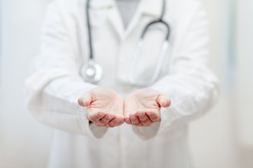 Empty hands of the Doctor , medical professional handed holding virtual object to paste text or item product . healthcare and advertisement concept, copy space