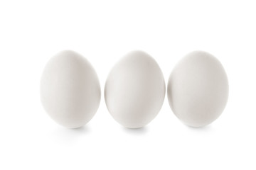 Raw chicken eggs on white background