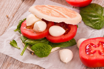Tigella bread with spinach and tomatoes.
