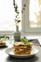 Plate with tasty squash waffles on grey table