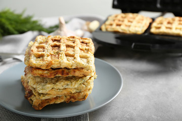 Stack of tasty squash waffles on plate