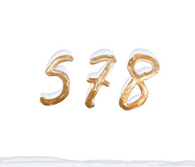 Gold Number 578 with Snow on white background