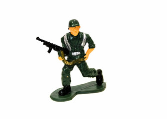 Fototapeta premium miniature toy soldier on white background, close-up