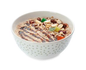 Tasty oatmeal with nuts and chocolate sauce in bowl on white background
