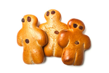 closeup of three traditional manalas bun with dried raisin on white background