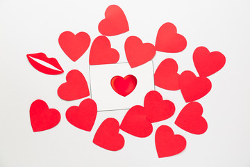 Many red hearts with Valentine's Day card on white background
